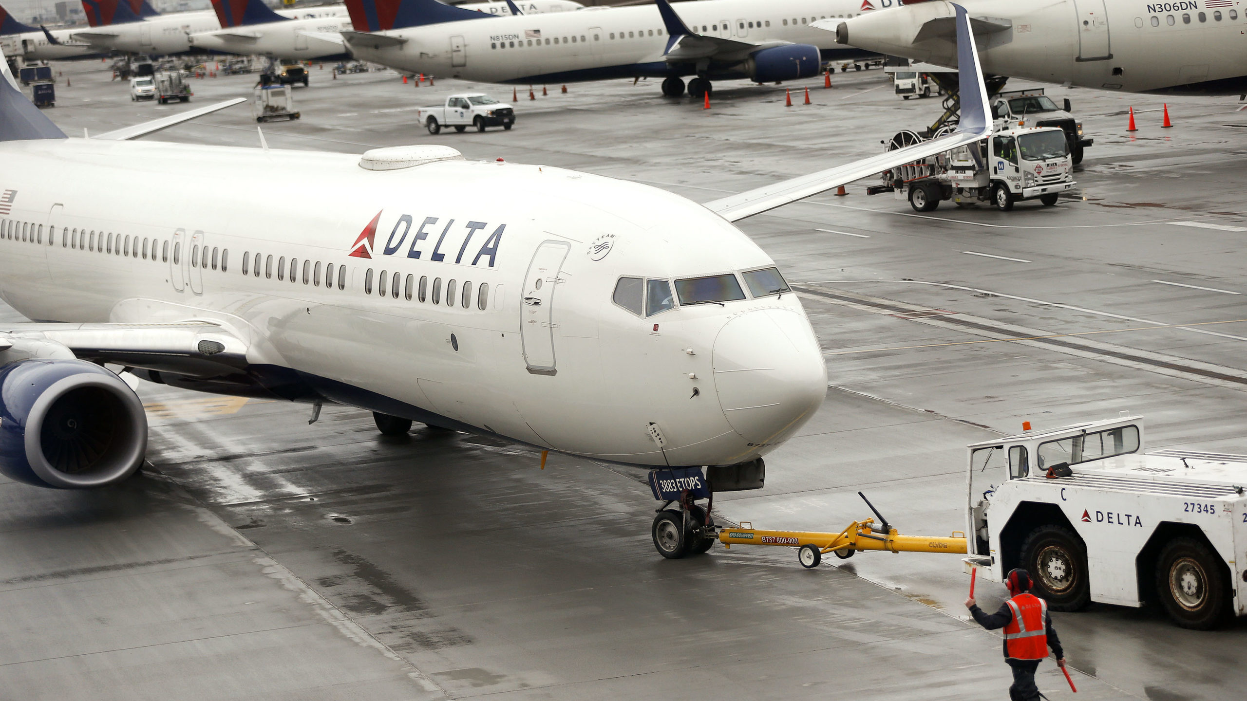 FILE -- A Delta plane departs from a hangar at the Salt Lake City International Airport in Salt Lak...