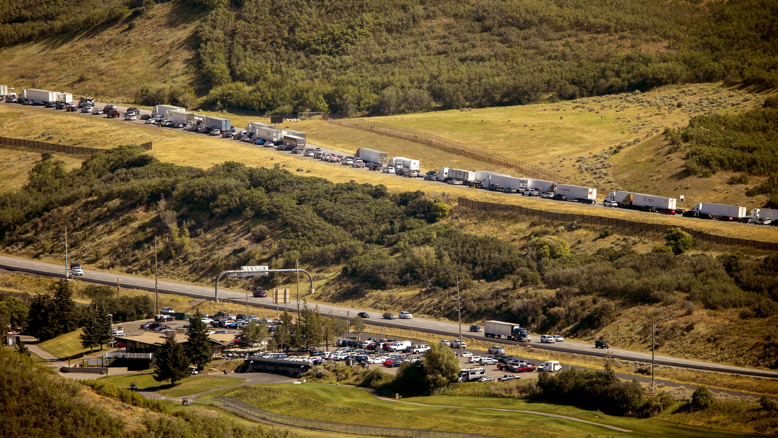 cars along parleys canyon are pictured lined up...