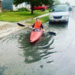 Enough rain fell in West Valley City to break out kayaks on surface streets. Photo: Brittany Baggott. 