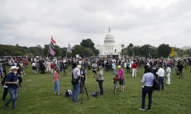 People attend a rally near the U.S. Capitol in Washington, Saturday, Sept. 18, 2021. The rally was ...
