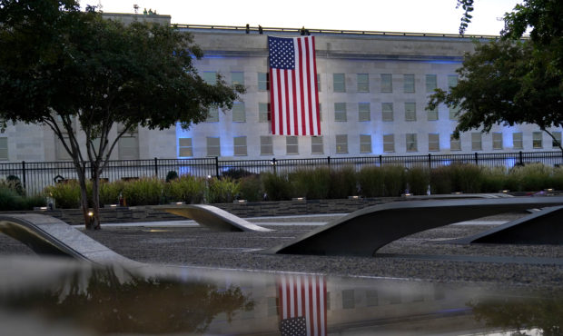 An American flag is unfurled at the Pentagon in Washington, Saturday, Sept. 11, 2021, at sunrise on...