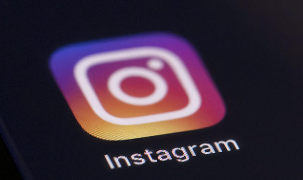 FILE - This Friday, Aug. 23, 2019, file photo shows the Instagram app icon on the screen of a mobil...
