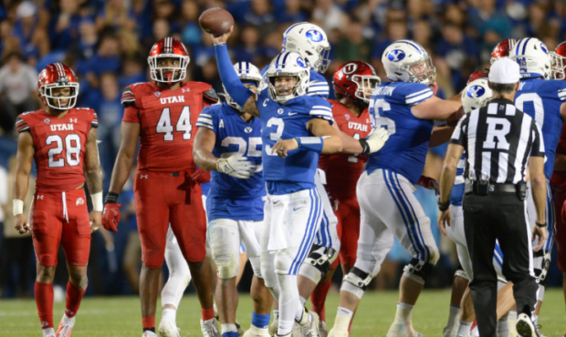 BYU quarterback Jaren Hall (3) celebrates after taking a knee on the final play during a game betwe...