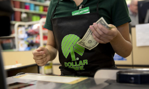 An employee works at a cash register at a Dollar Tree Inc. store in Chicago, Illinois, U.S., on Tue...