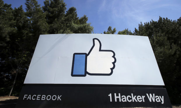 FILE - In this April 14, 2020 file photo, the thumbs up Like logo is shown on a sign at Facebook he...