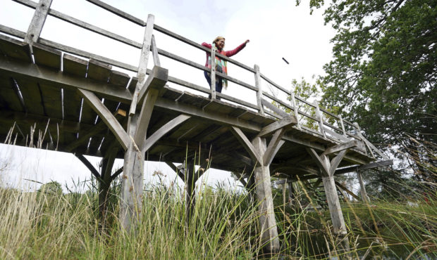 Silke Lohmann of Summers Place Auctions stands on the original Poohsticks Bridge from Ashdown Fores...