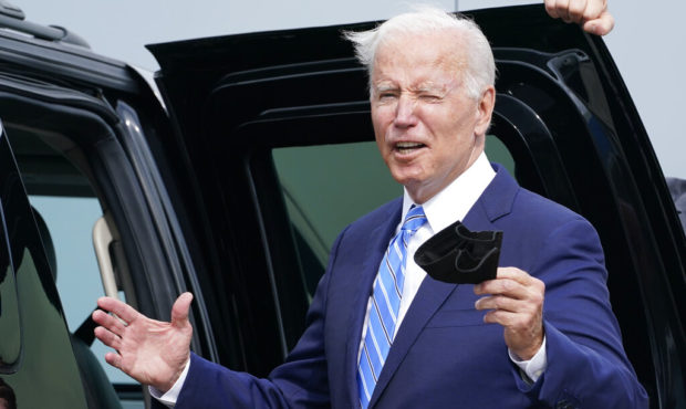 President Joe Biden responds to a question about the short term deal on debt as he arrives Air Forc...