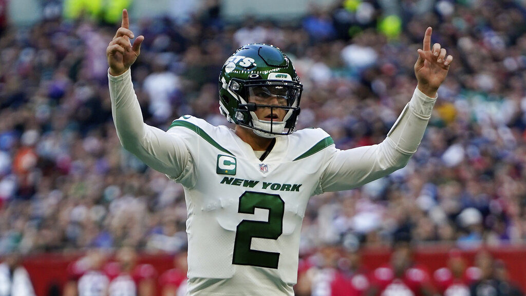 New York Jets quarterback Zach Wilson (2) celebrates after scoring a touchdown during an NFL footba...