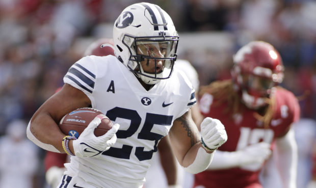 BYU running back Tyler Allgeier carries the ball during the first half of an NCAA college football ...