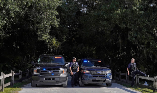 North Port police officers block the entrance to the Myakkahatchee Creek Environmental Park Wednesd...