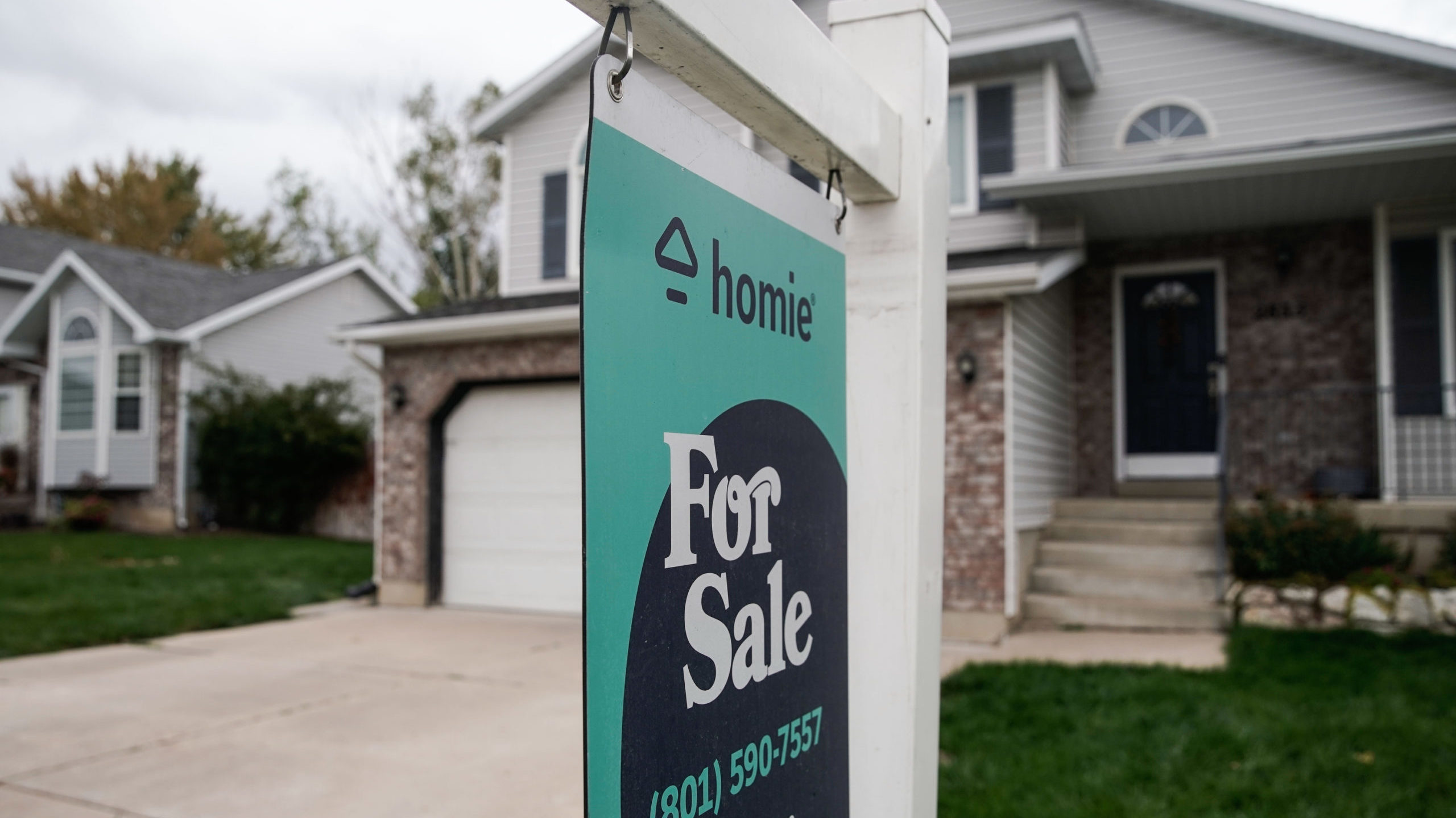 A “for sale” sign is displayed outside of a house in Layton. 
Photo: Shafkat Anowar, Deseret Ne...