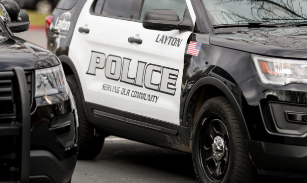 FILE -- Police cruisers are parked outside the Layton Police Department on Tuesday, March 31, 2020....