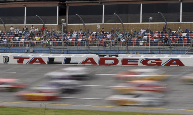 Cars race during a NASCAR Cup series auto race Monday, Oct. 4, 2021, in Talladega, Ala. (AP Photo/J...