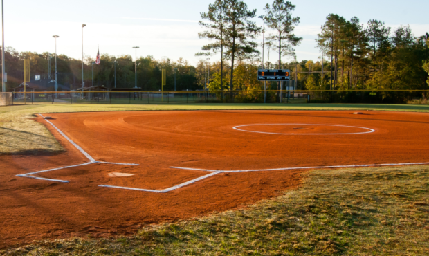 Image of a softball field taken from home base. Photo: Canva...