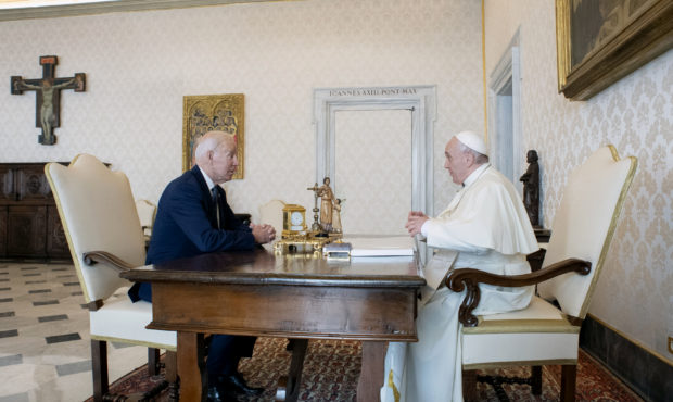 US President Joe Biden, left, talks with Pope Francis as they meet at the Vatican, Friday, Oct. 29,...