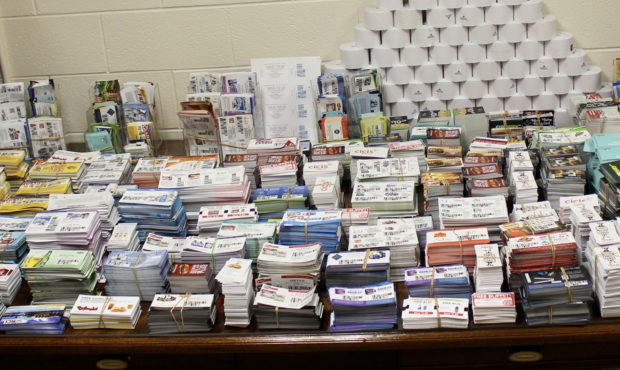 During a search of Lori Ann Talens' home, agents found thousands of counterfeit coupons, rolls of c...
