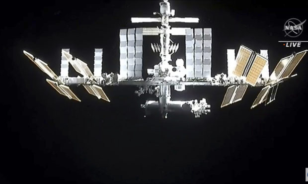 In this image from video provided by NASA, the International Space Station is seen as astronauts in...