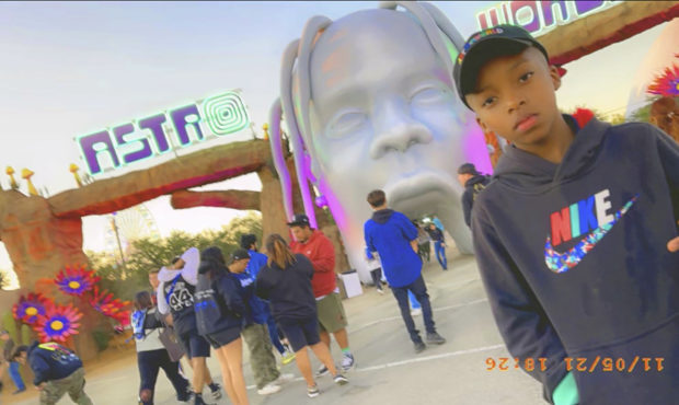This photo provided by Taylor Blount shows Ezra Blount, 9, posing outside the Astroworld music fest...