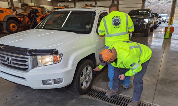 UDOT crews inspect a vehicle for tire quality and proper traction devices to obtain a Cottonwood Ca...