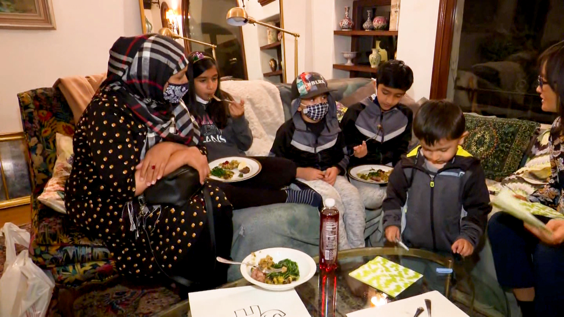 Asghary's family enjoys its first Thanksgiving meal. Photo credit: CNN...