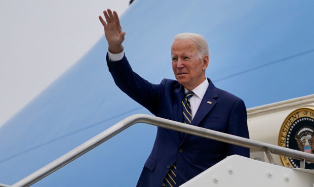 U.S. President Joe Biden waves as he boards Air Force One after attending the G20 summit in Rome, M...