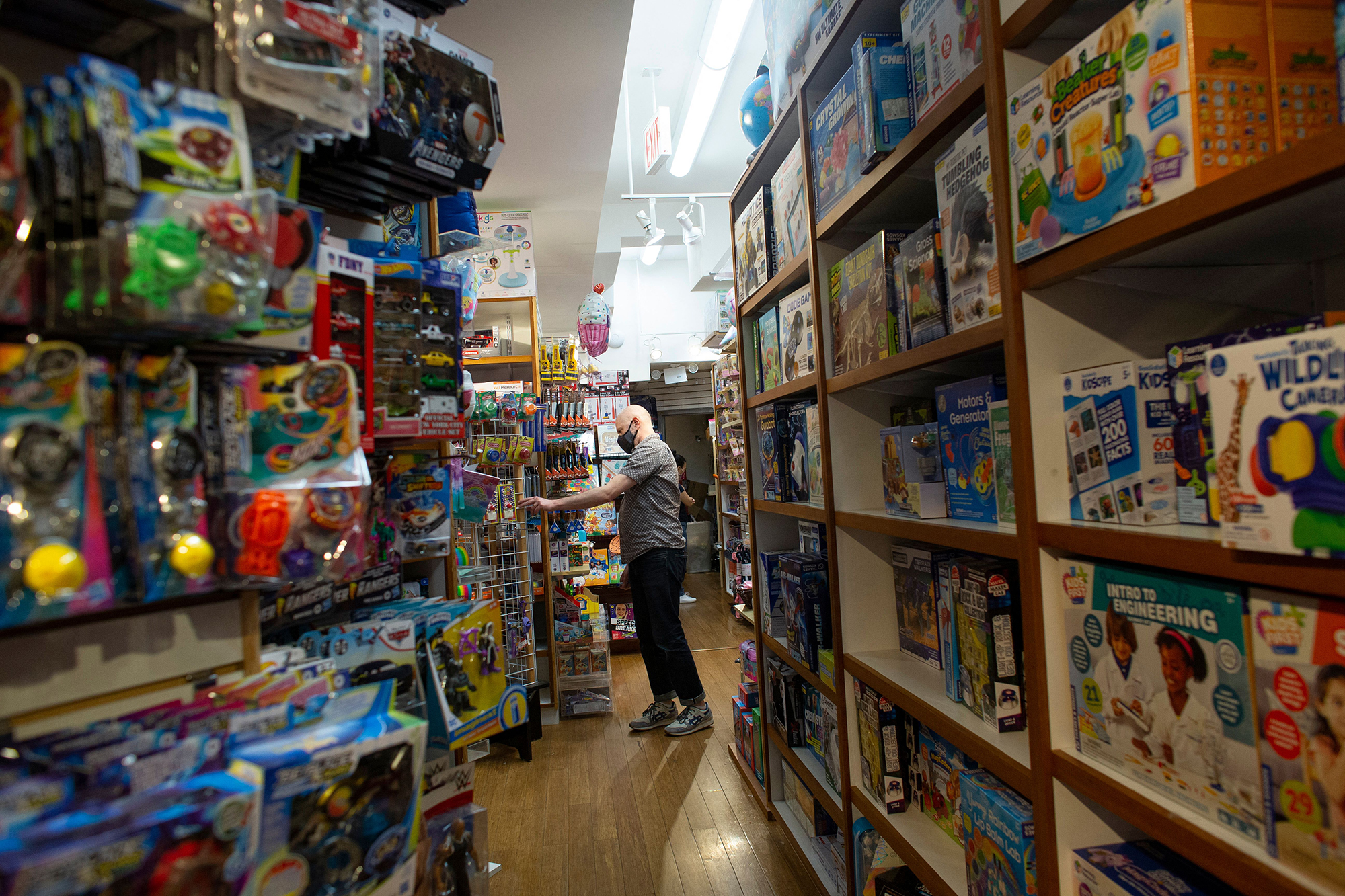 An employee walks in the aisles of Mary Arnold Toys, New York city oldest toy store on August 2, 20...