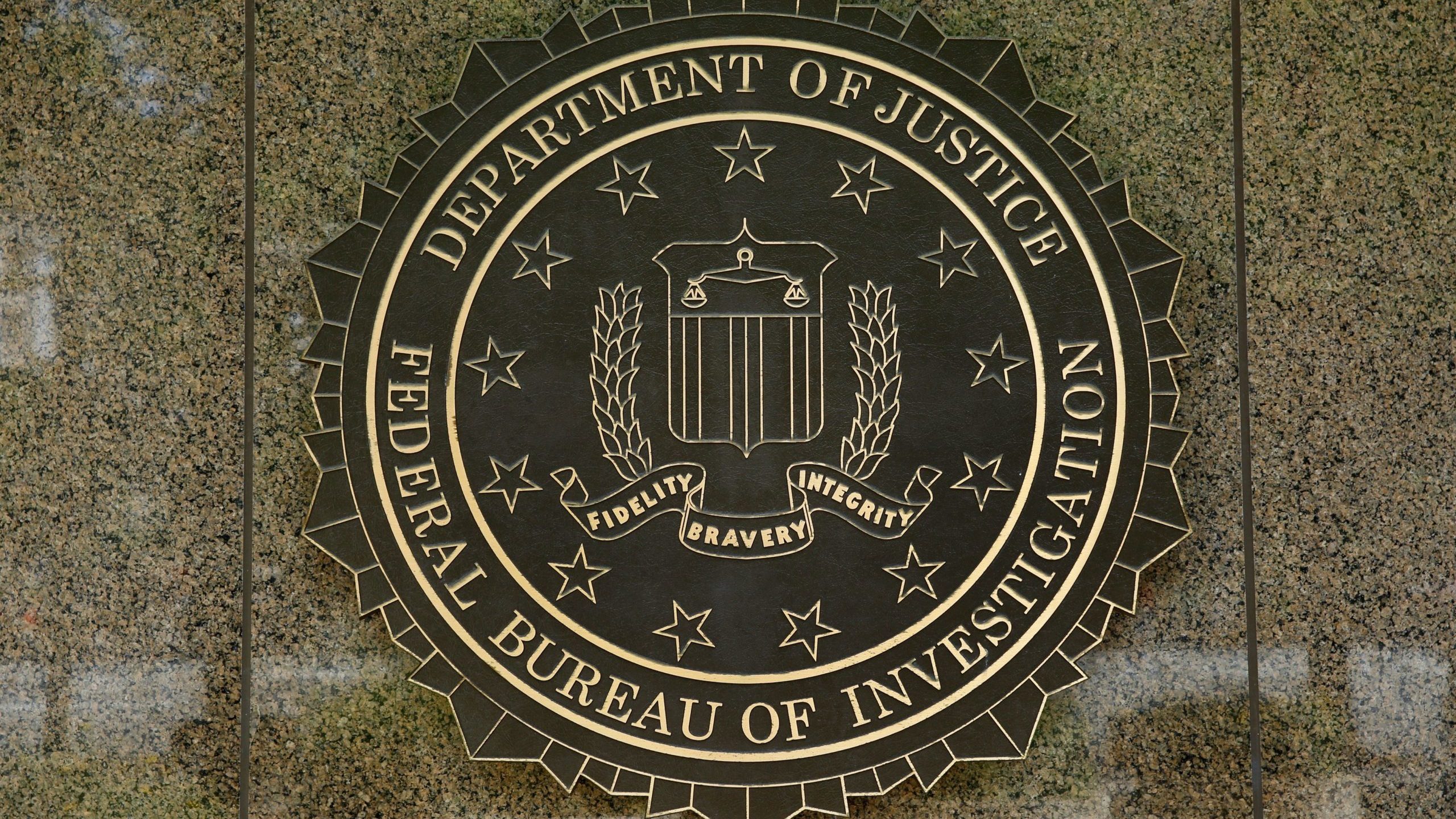 The FBI seal is seen outside the headquarters building in Washington, DC on July 5, 2016. - The FBI...