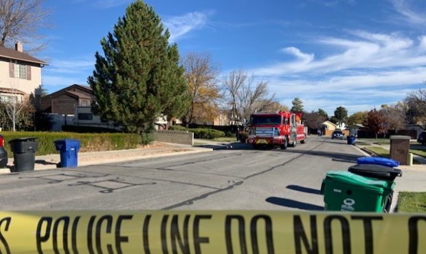(Unified Fire Authority trucks outside the Taylorsville home where the suspect's body was found.  P...