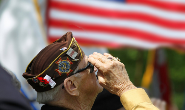 Veteran salutes the American flag photo: Canva...