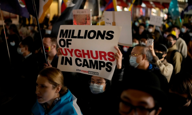 Demonstrators supporting Tibetans, Uyghurs and Hong Kongers take part in a protest against the Chin...
