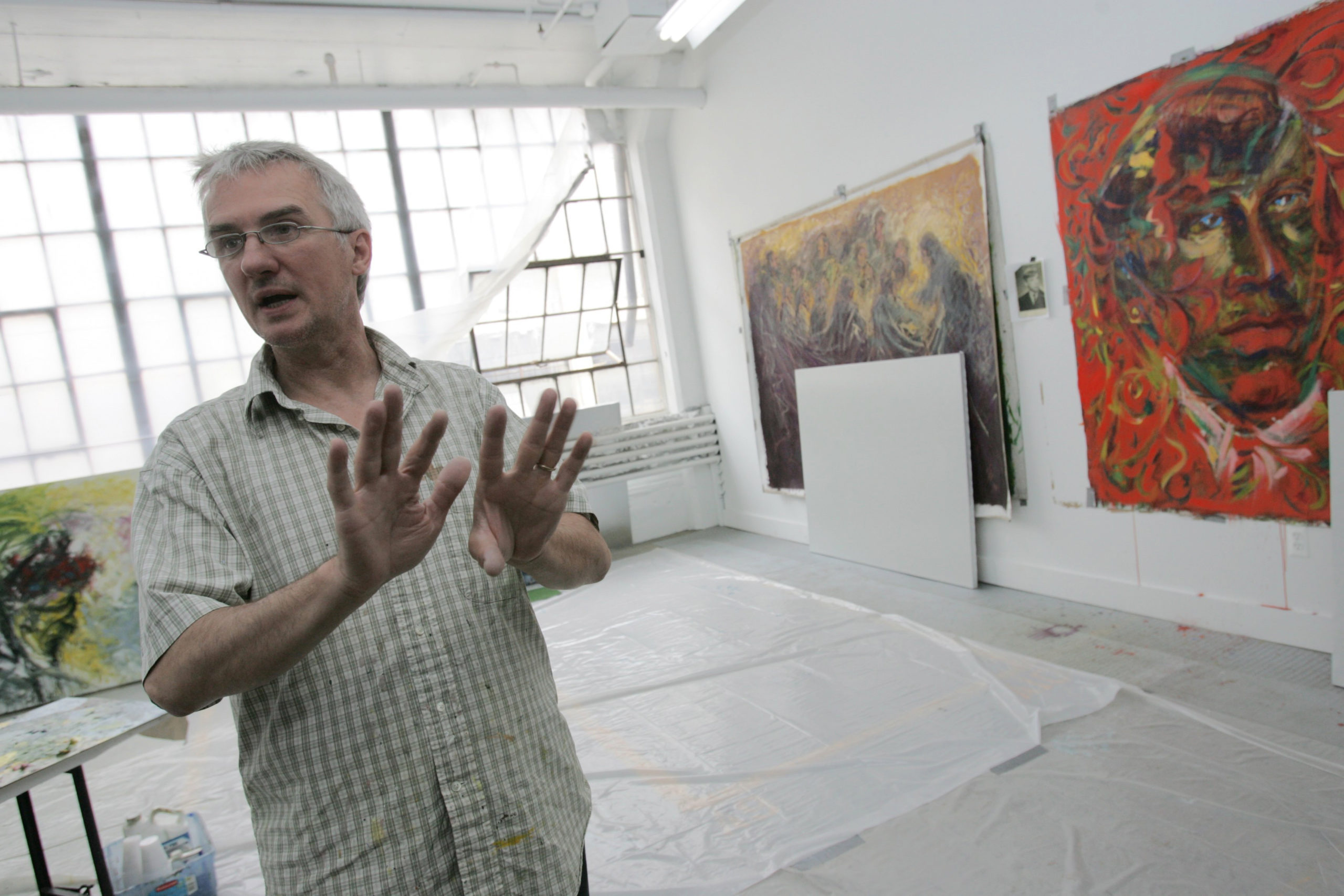 Artist Andrzej Sikora speaks of his art work in his studio at The Russell Industrial Center in Detr...