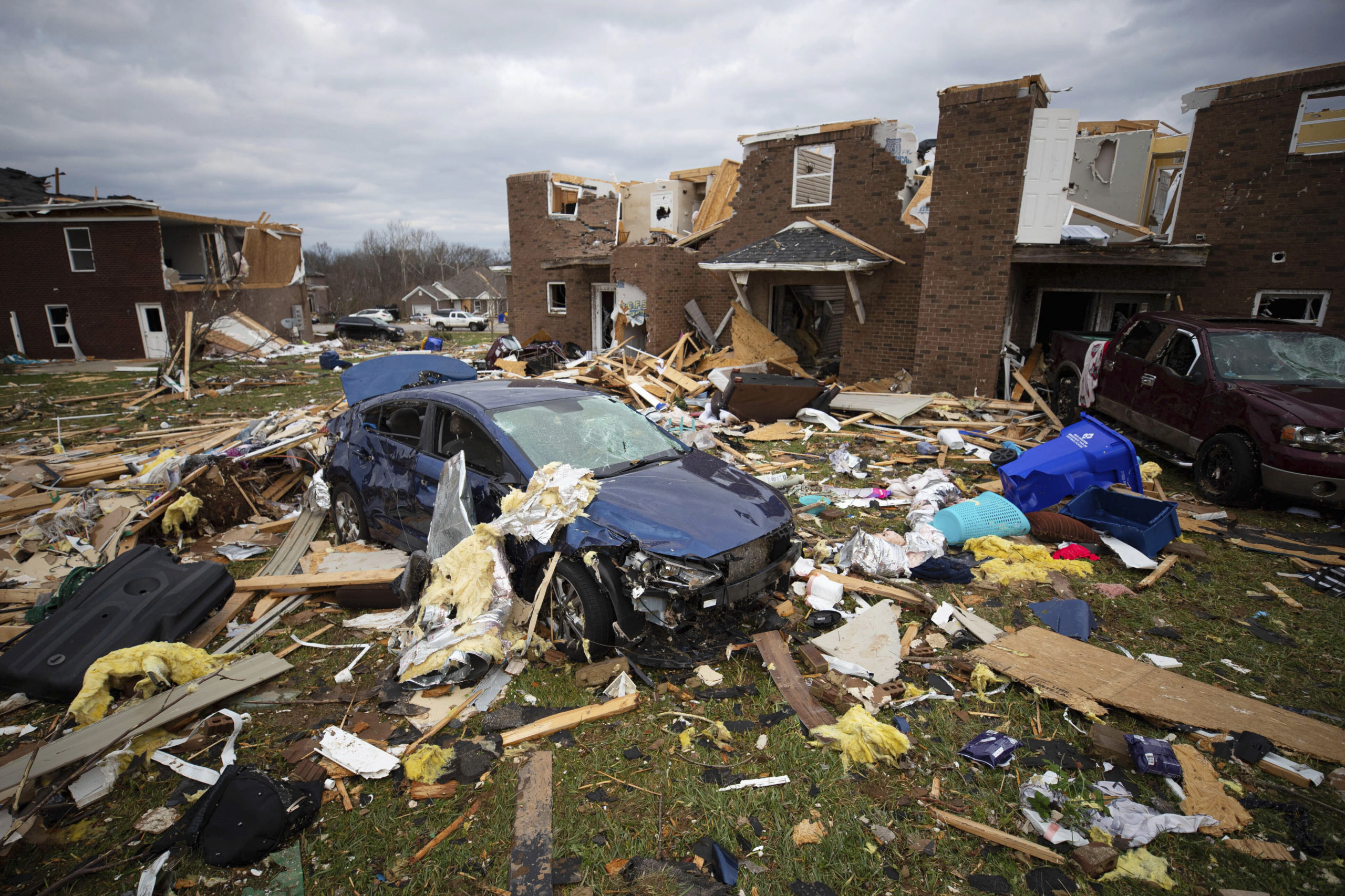 A car sits in the debris caused by a tornado in Bowling Green, Ky., Saturday, Dec. 11, 2021. A mons...