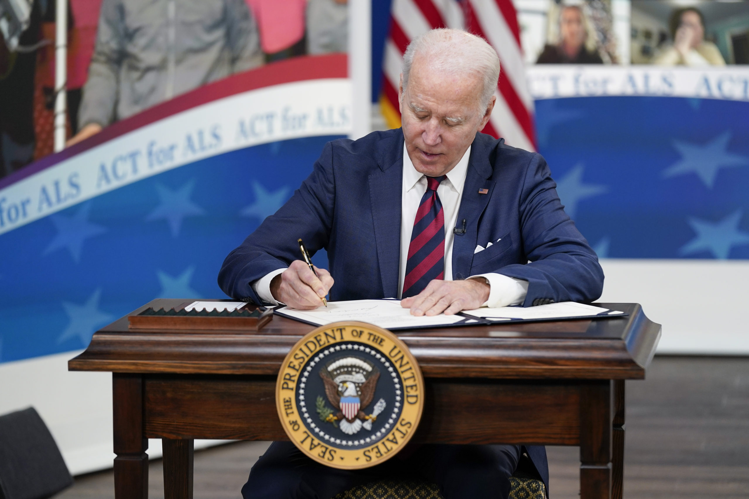 President Joe Biden signs the "Accelerating Access to Critical Therapies for ALS Act" into law duri...