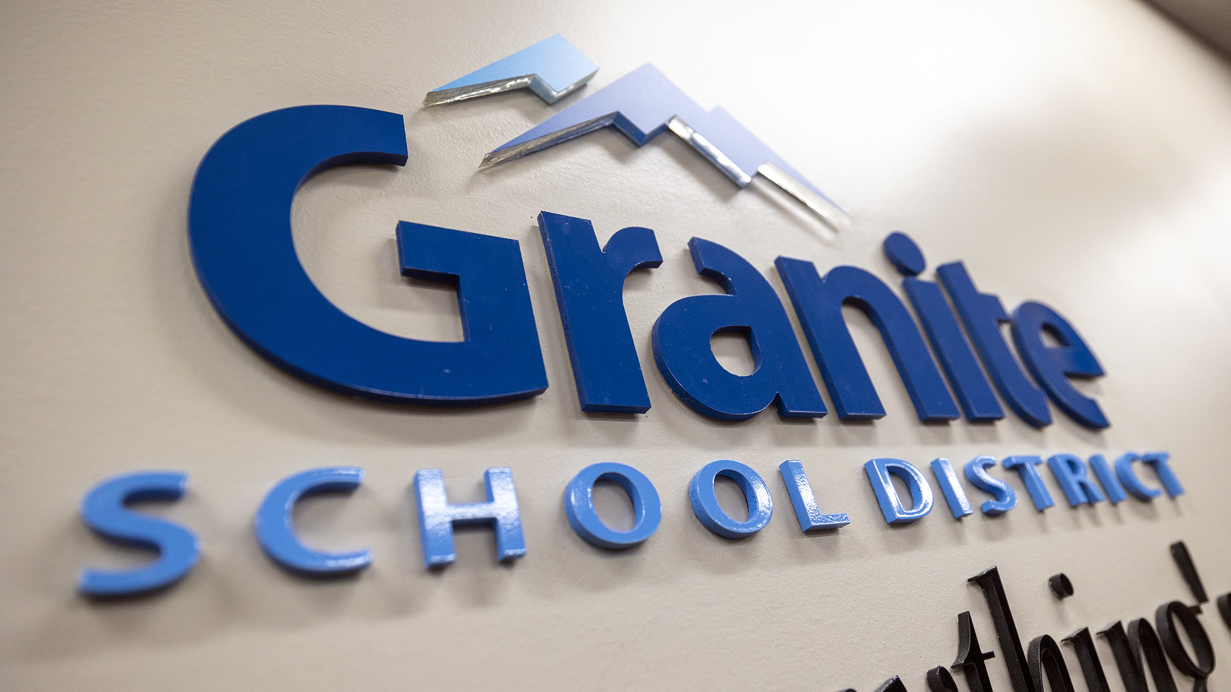 granite school district sign pictured, one of its principals will sleep on the roof...