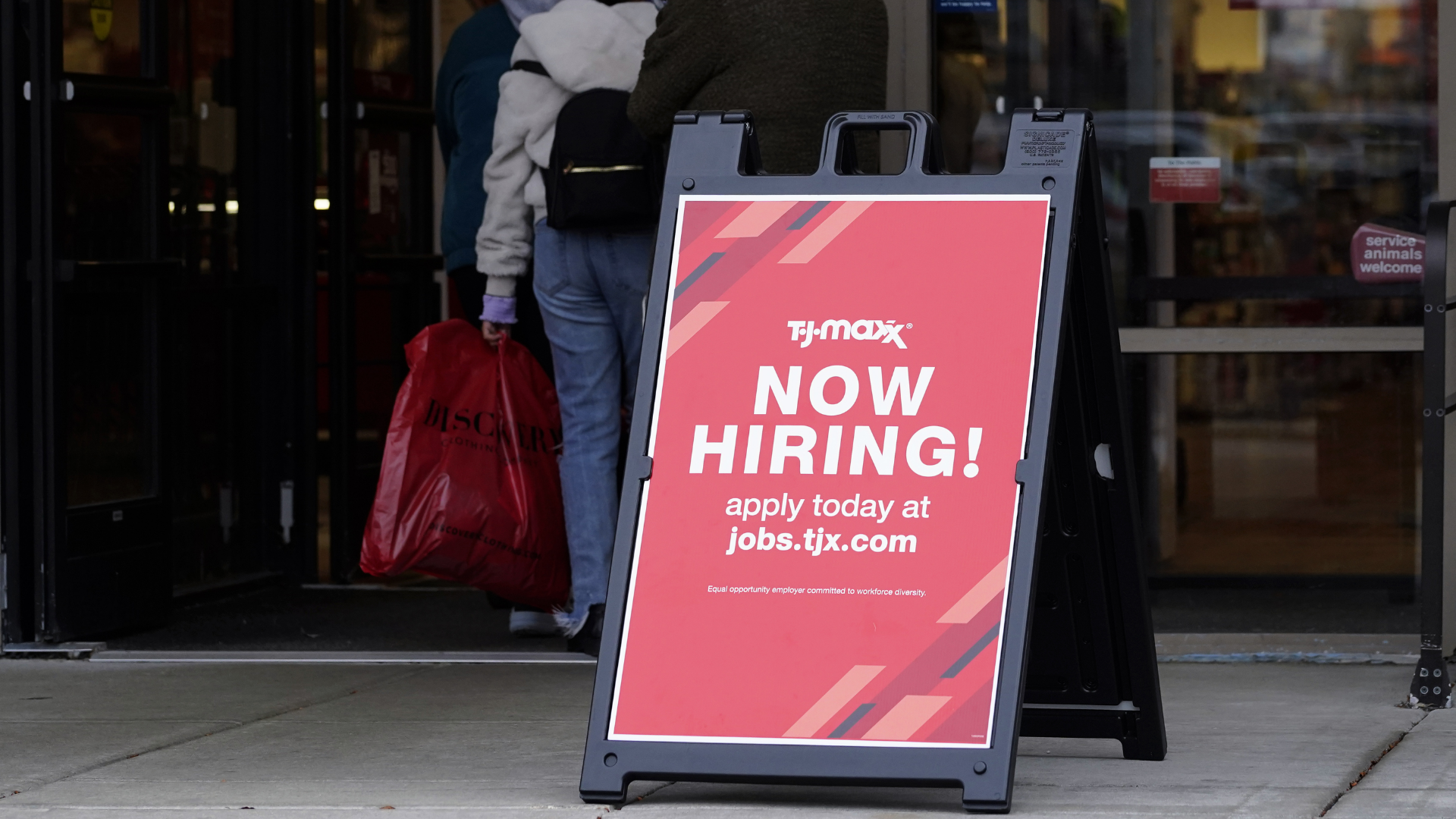 Hiring sign is displayed outside of a retail store in Vernon Hills, Ill., Saturday, Nov. 13, 2021. ...