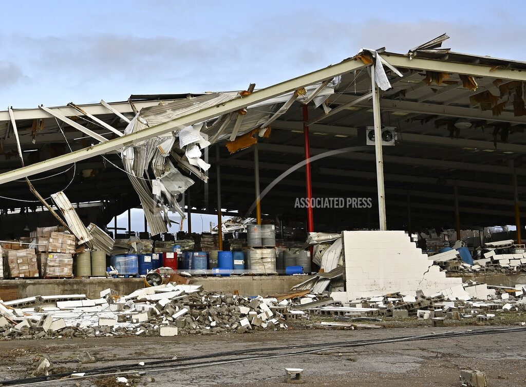 A feed store damaged by a tornado is seen in Mayfield, Ky.,on Saturday, Dec. 11, 2021. Tornadoes an...