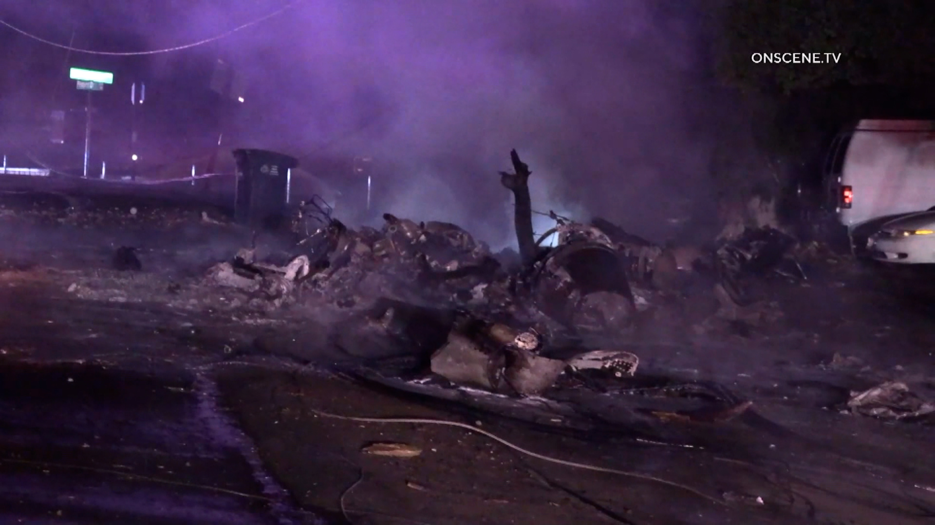 Wreckage of a plane crash covers a street in El Cajon, California. Photo: ONSCENE.TV...