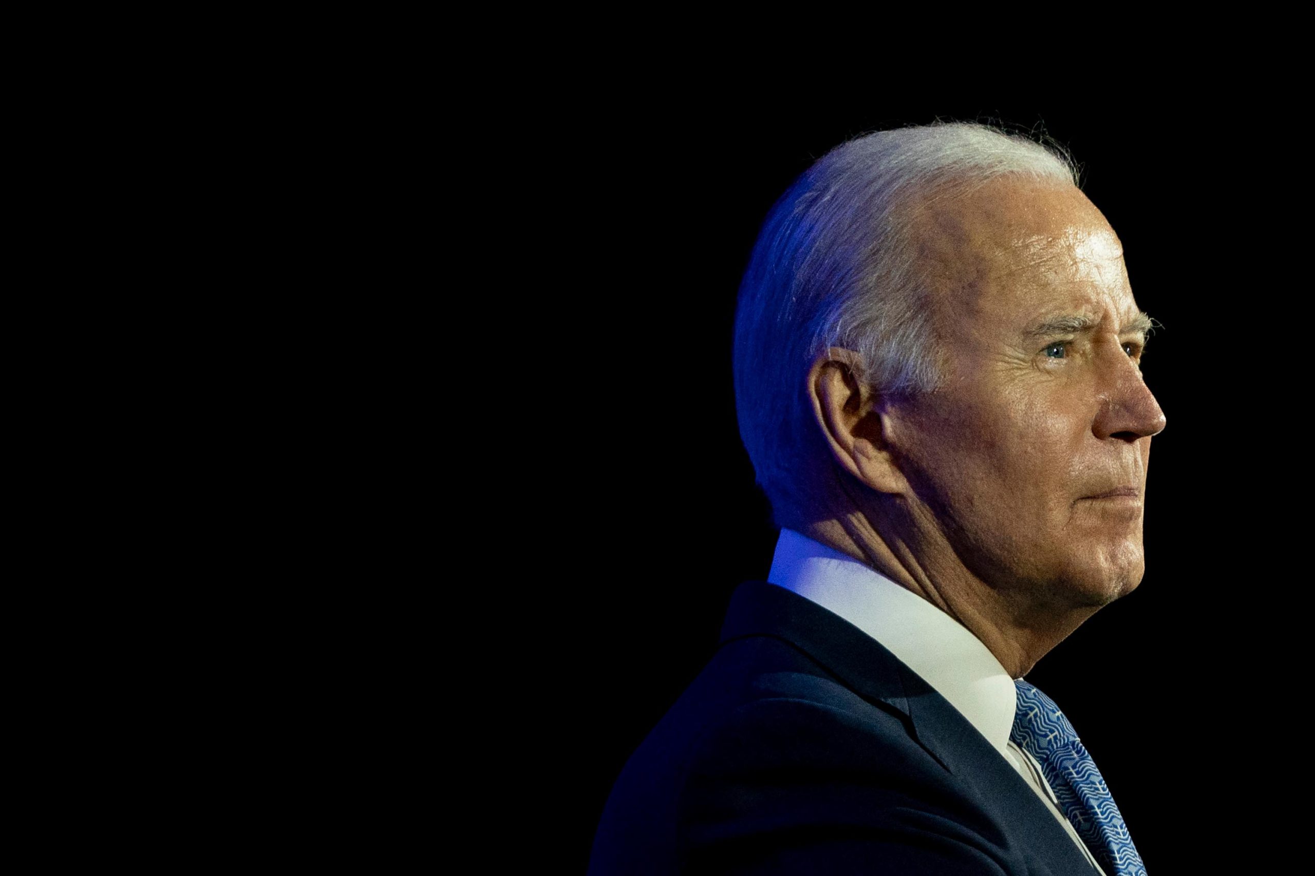 US President Joe Biden speaks during a holiday reception for the Democratic National Committee at H...