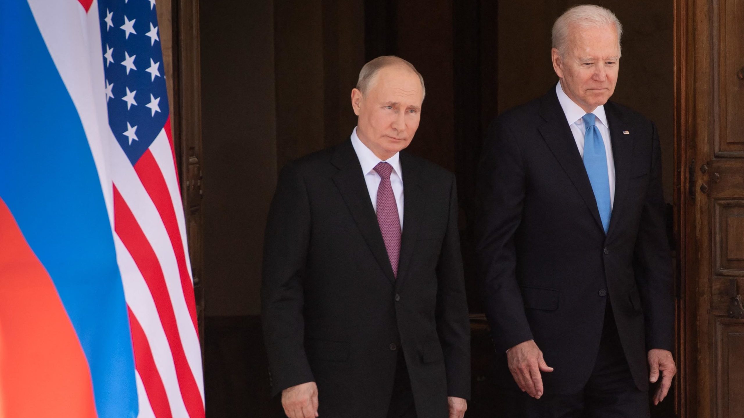 US President Joe Biden (R) and Russian President Vladimir Putin arrive for a US-Russia summit at Vi...