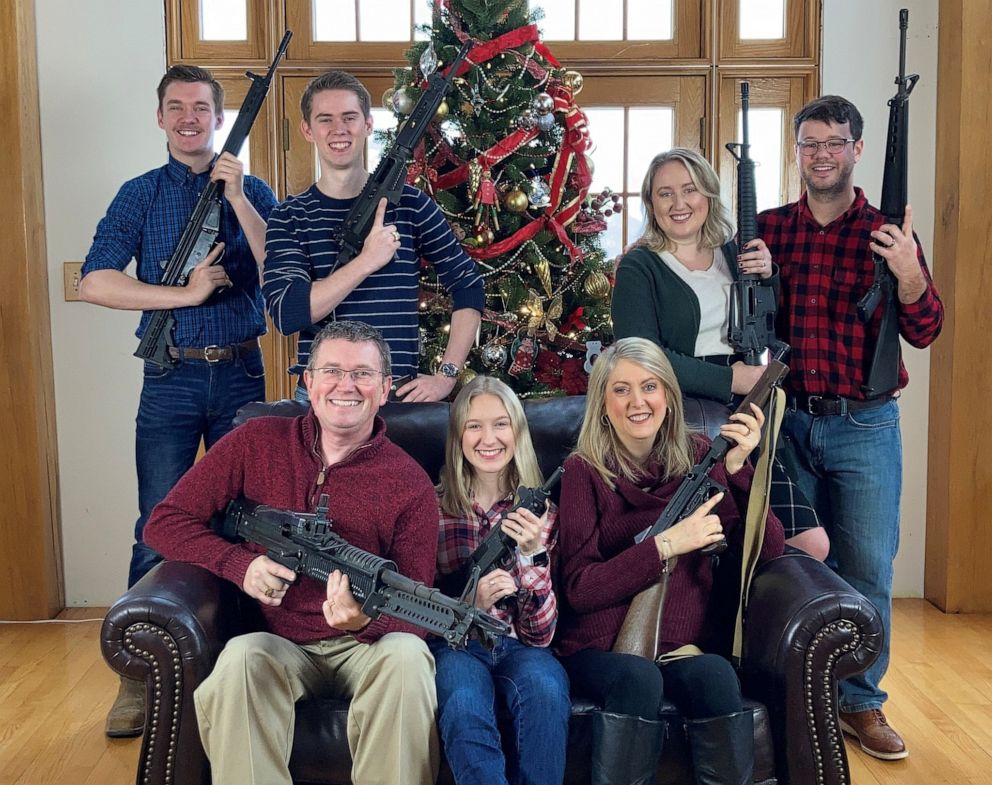 Christmas card of Massie family with rifles...