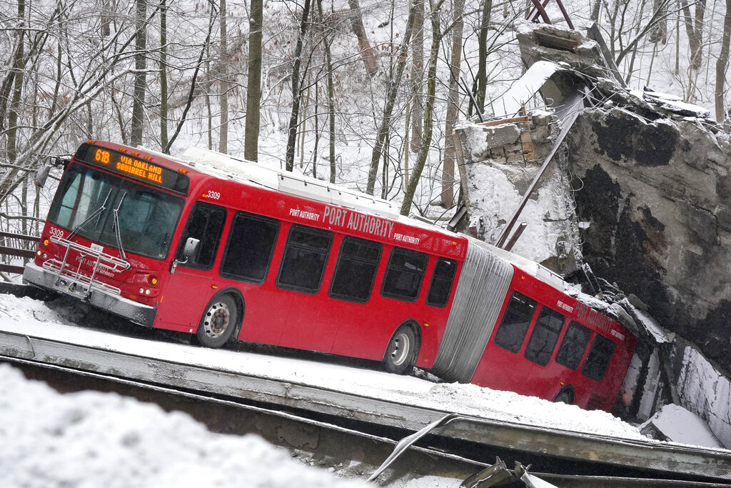 A Port Authority bus that was on a bridge when it collapsed Friday Jan. 28, 2022, is visible in Pit...
