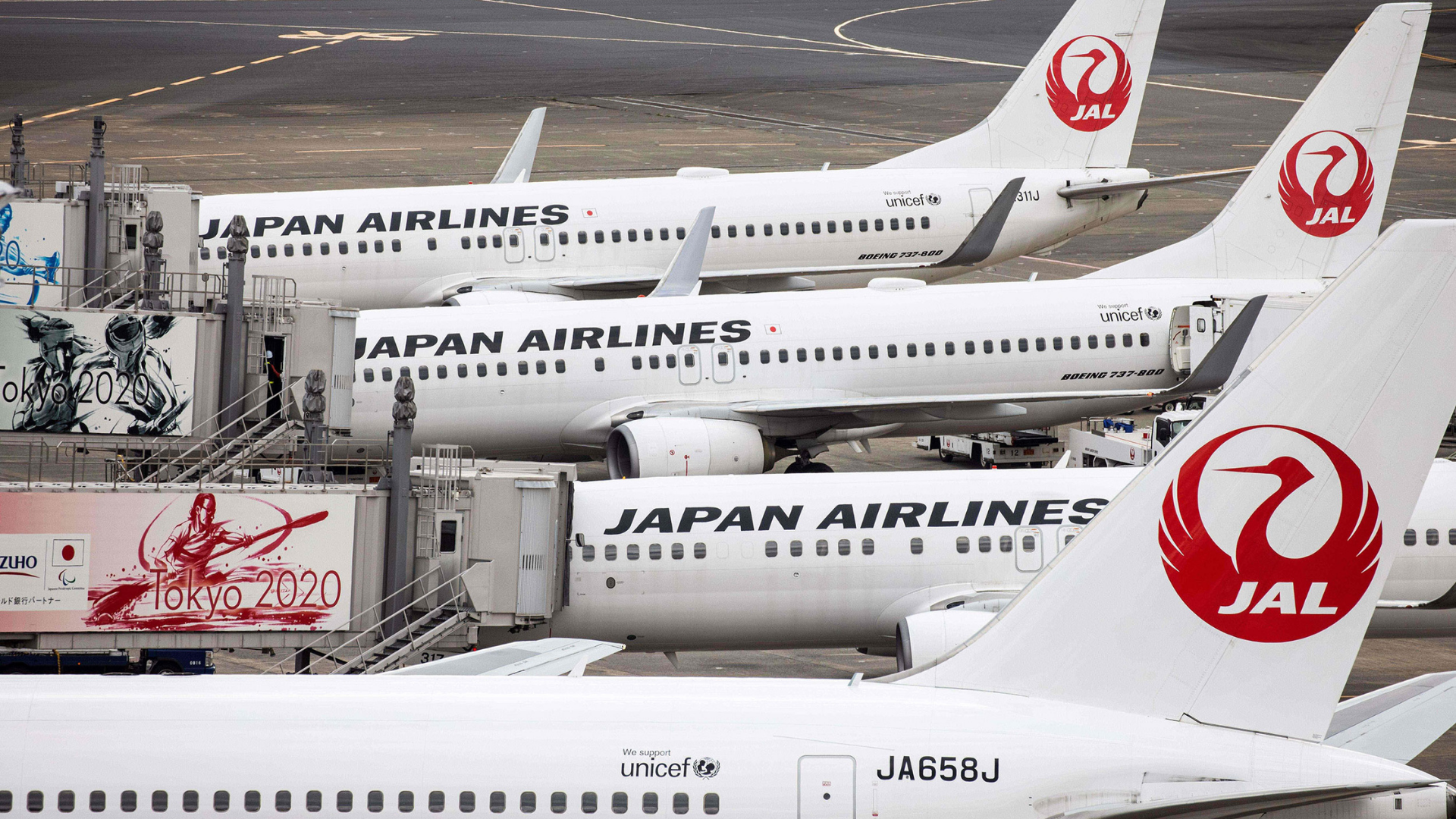 Passenger jets of Japan Airlines (JAL) are seen on the tarmac at Tokyo's Haneda airport on October ...