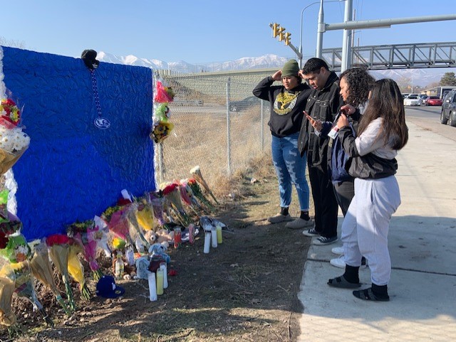 (Loved ones of the two shooting victims paying their respects at a makeshift memorial.  Photo: Paul...