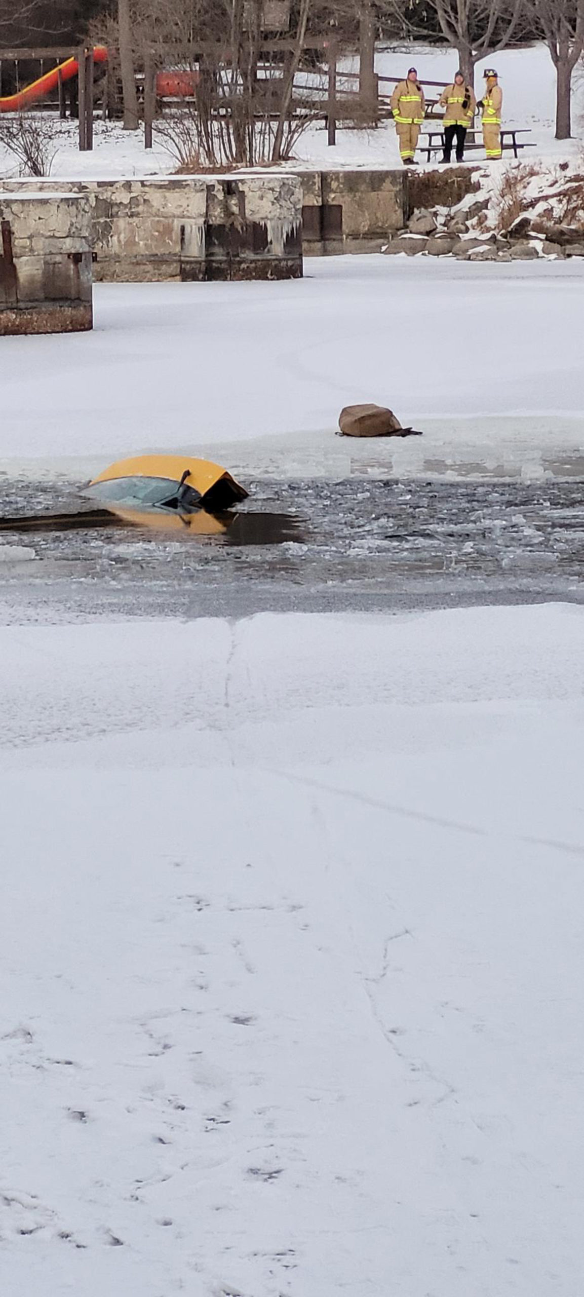 The car sank in the river after a woman drove across the frozen water. Photo credit: Ottawa Police...