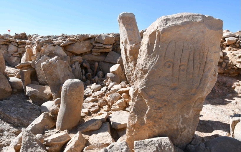 This photo provided by Jordan Tourism Ministry shows two carved standing stones at a remote Neolith...