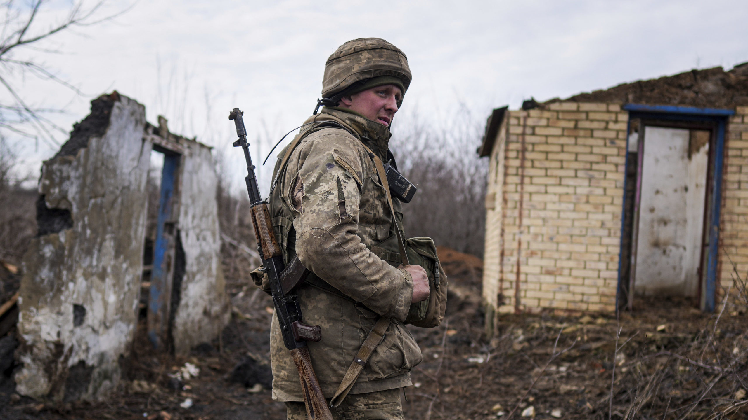 A Ukrainian serviceman stands at his position at the line of separation between Ukraine-held territ...