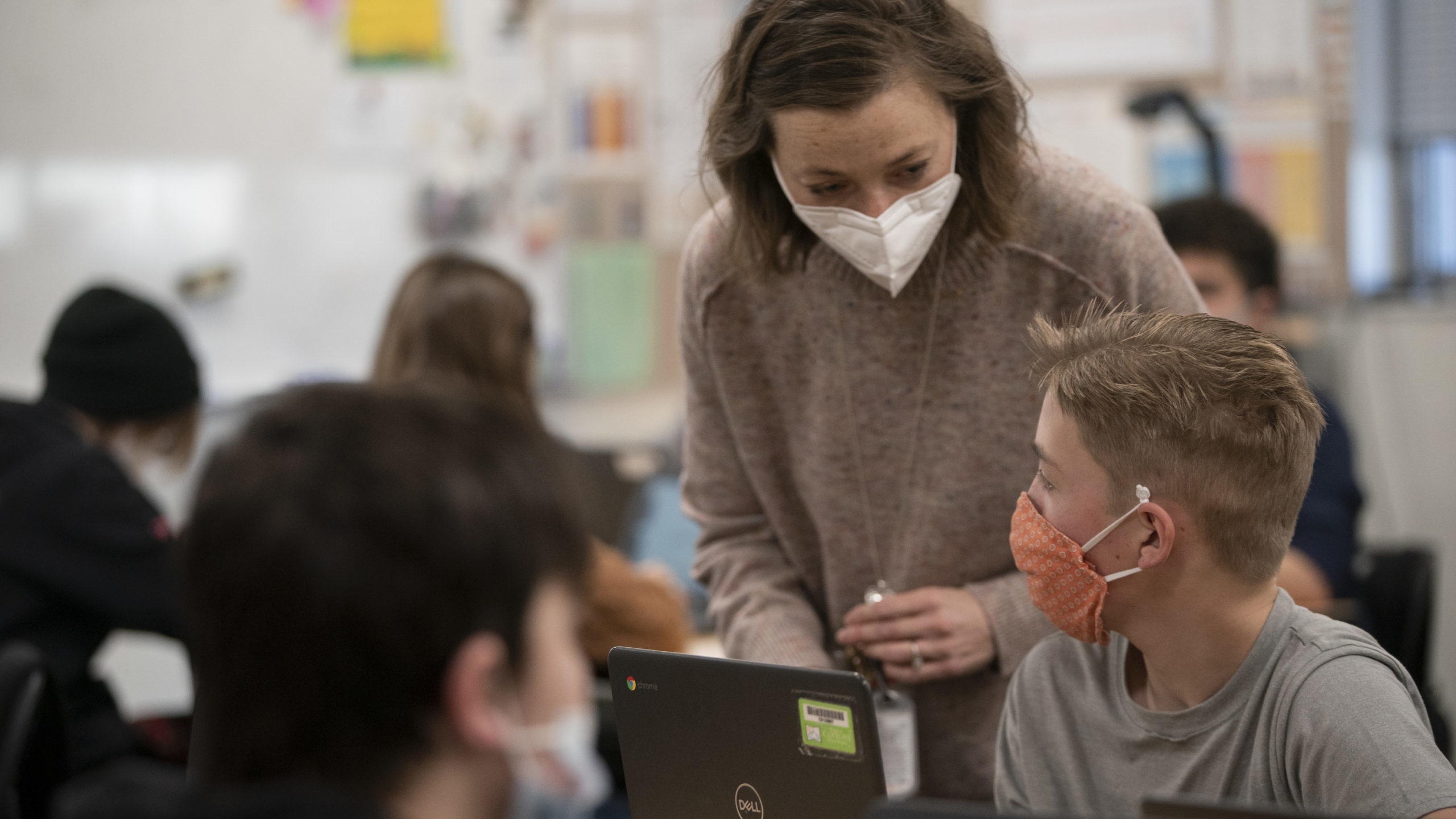Eighth grade students and their teacher wear masks during their dual language class at Mount Jordan...