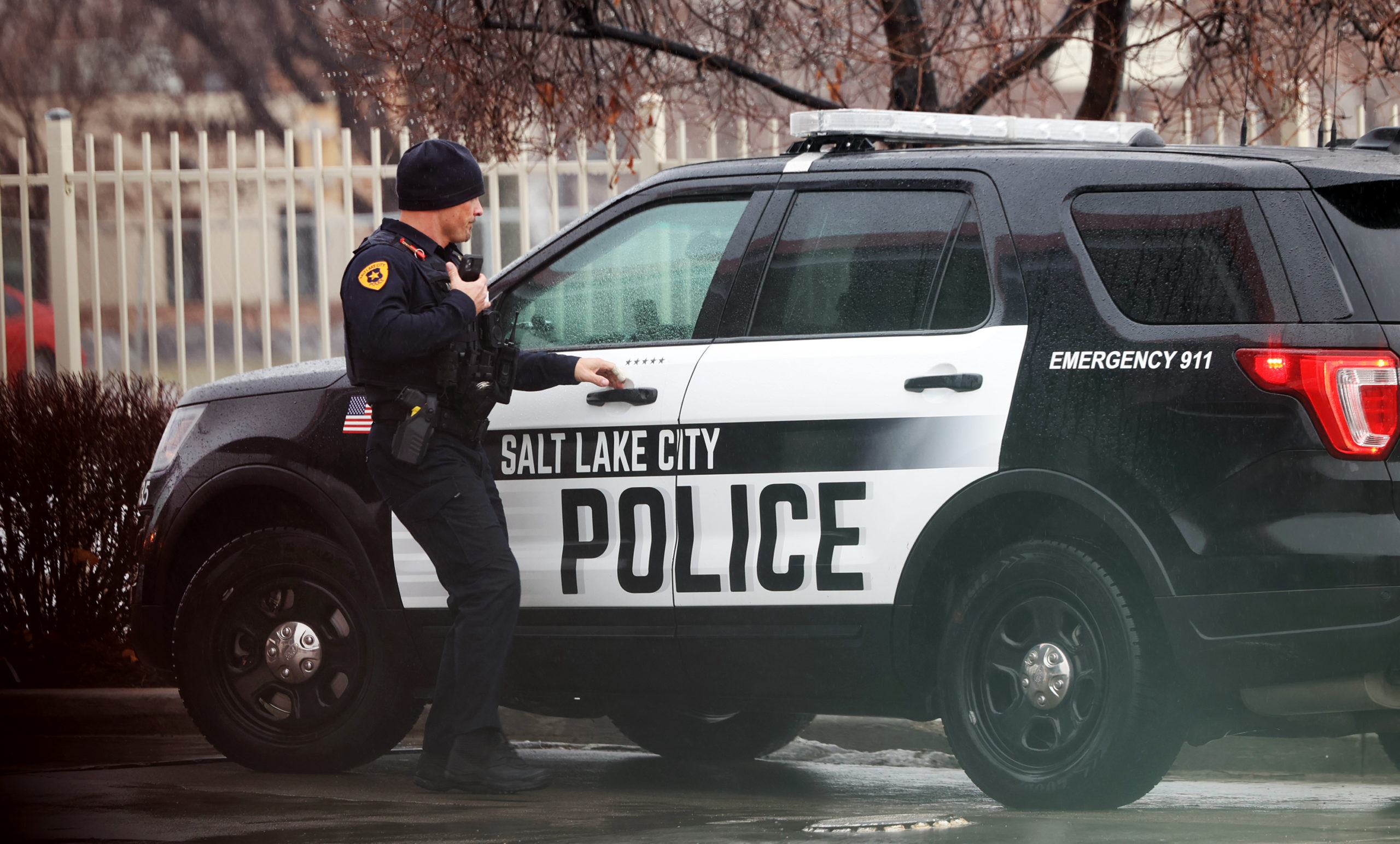 A Salt Lake City police officer works at the scene of a collision on Redwood Road and 700 North in ...