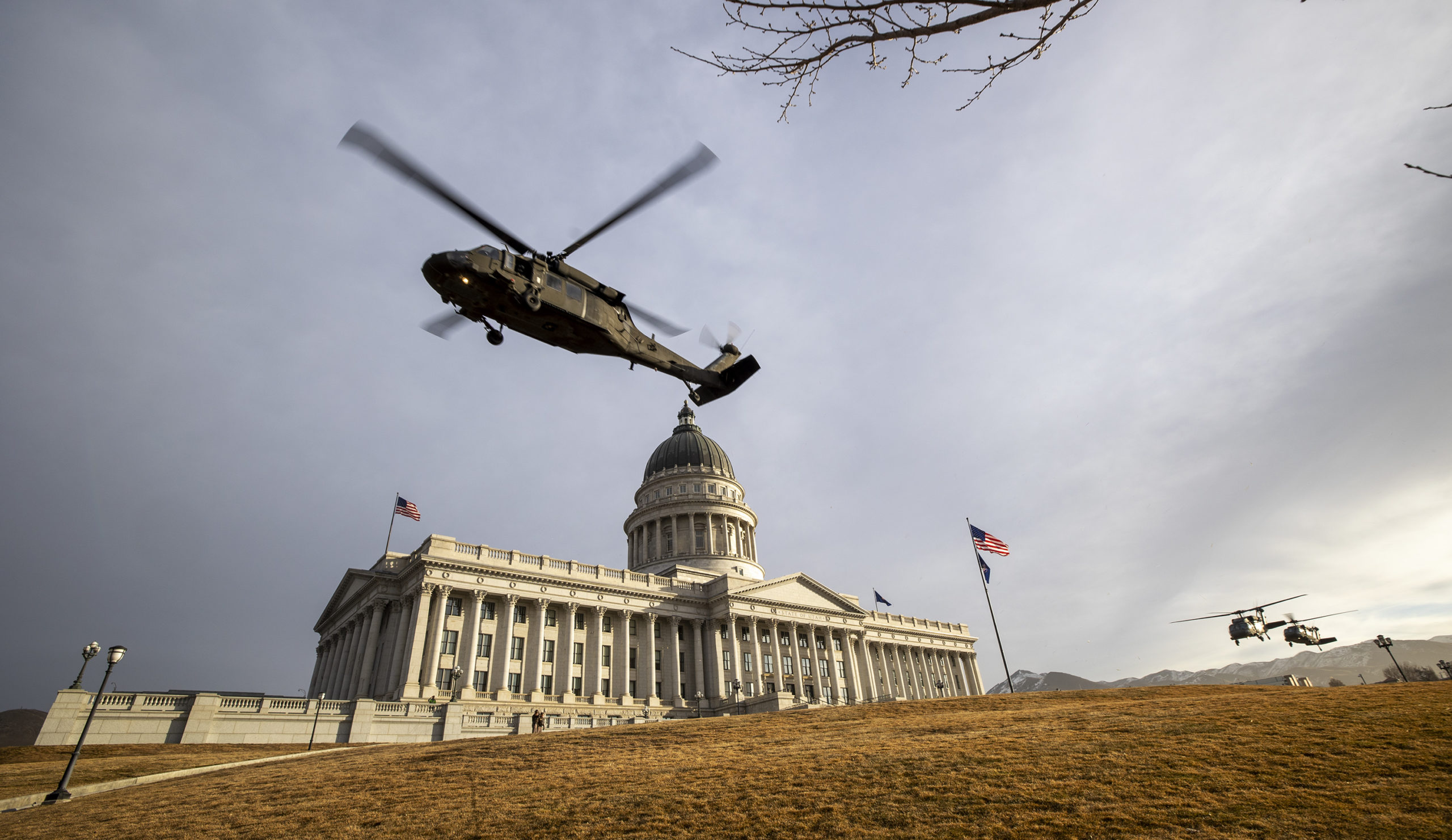 Three Blackhawk helicopters from the Utah Army National Guard carrying Utah lawmakers lift off from...