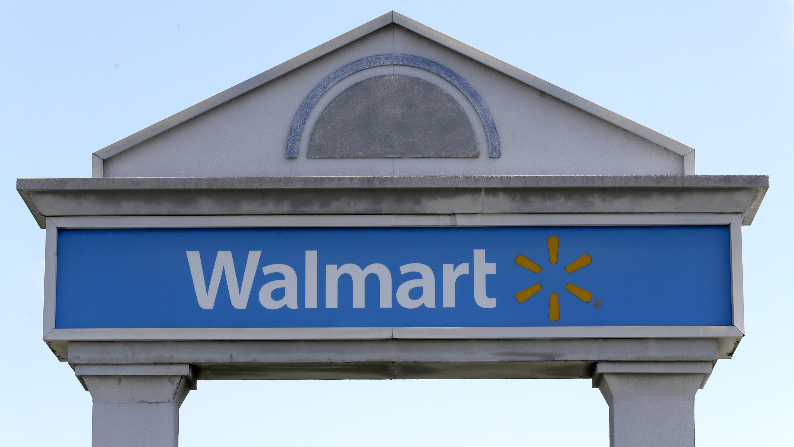 FILE - In this Sept. 3, 2019, file photo, a Walmart logo forms part of a sign outside a Walmart sto...